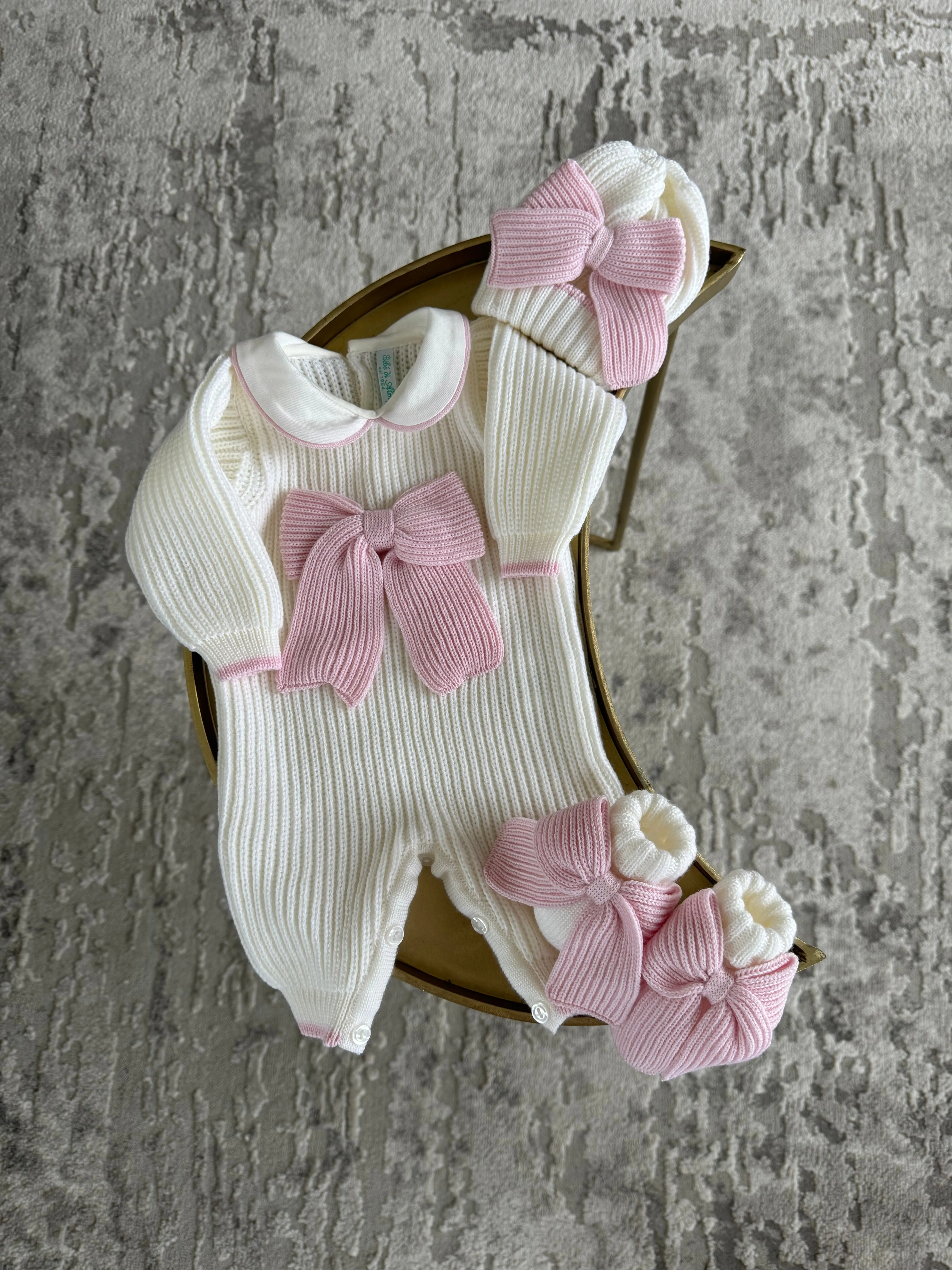 Beautiful knitted Merino Wool Ivory/White Baby Girl Romper with Bow details.