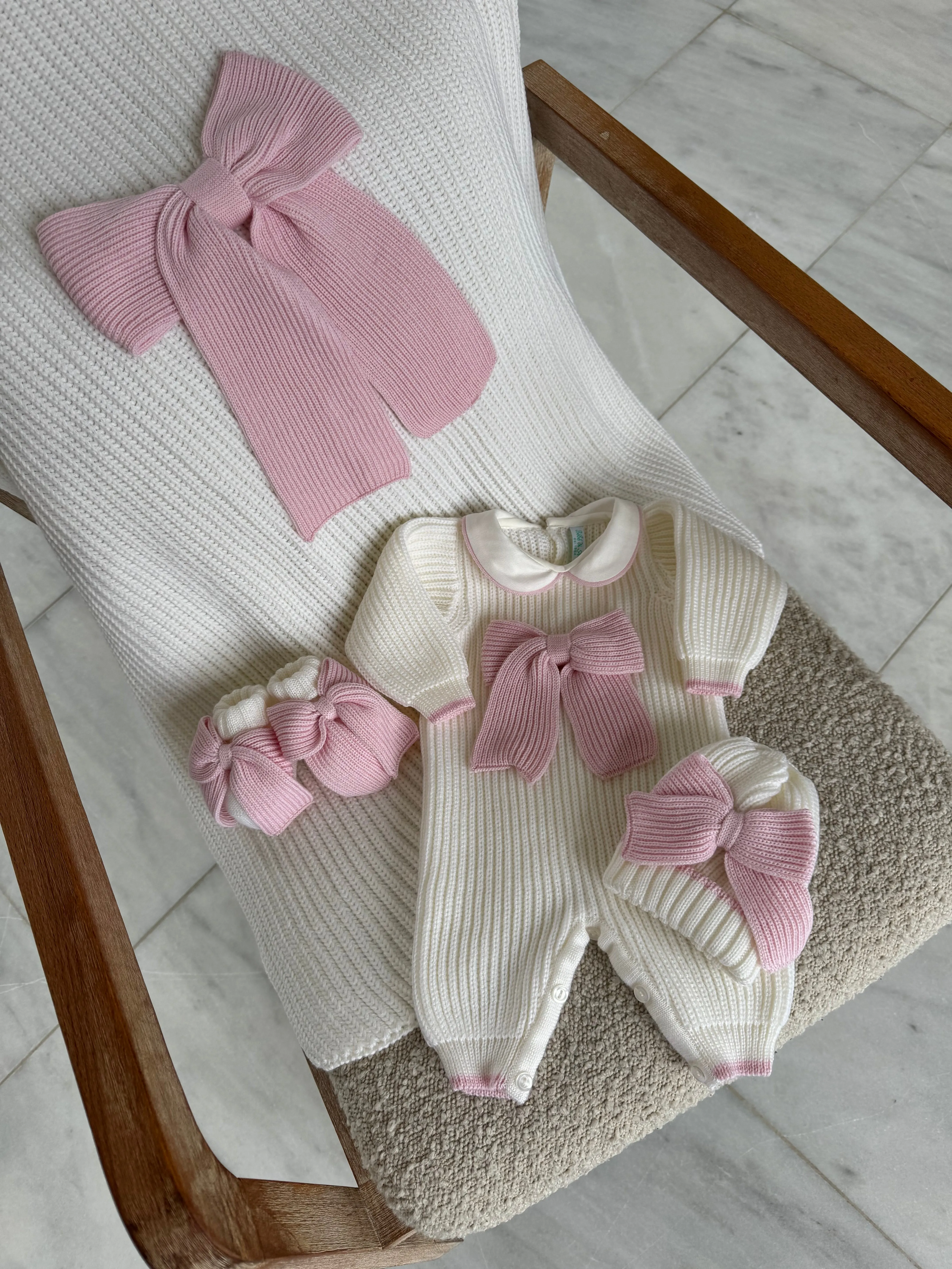 Beautiful knitted Merino Wool Ivory/White Baby Girl Romper with Bow details.