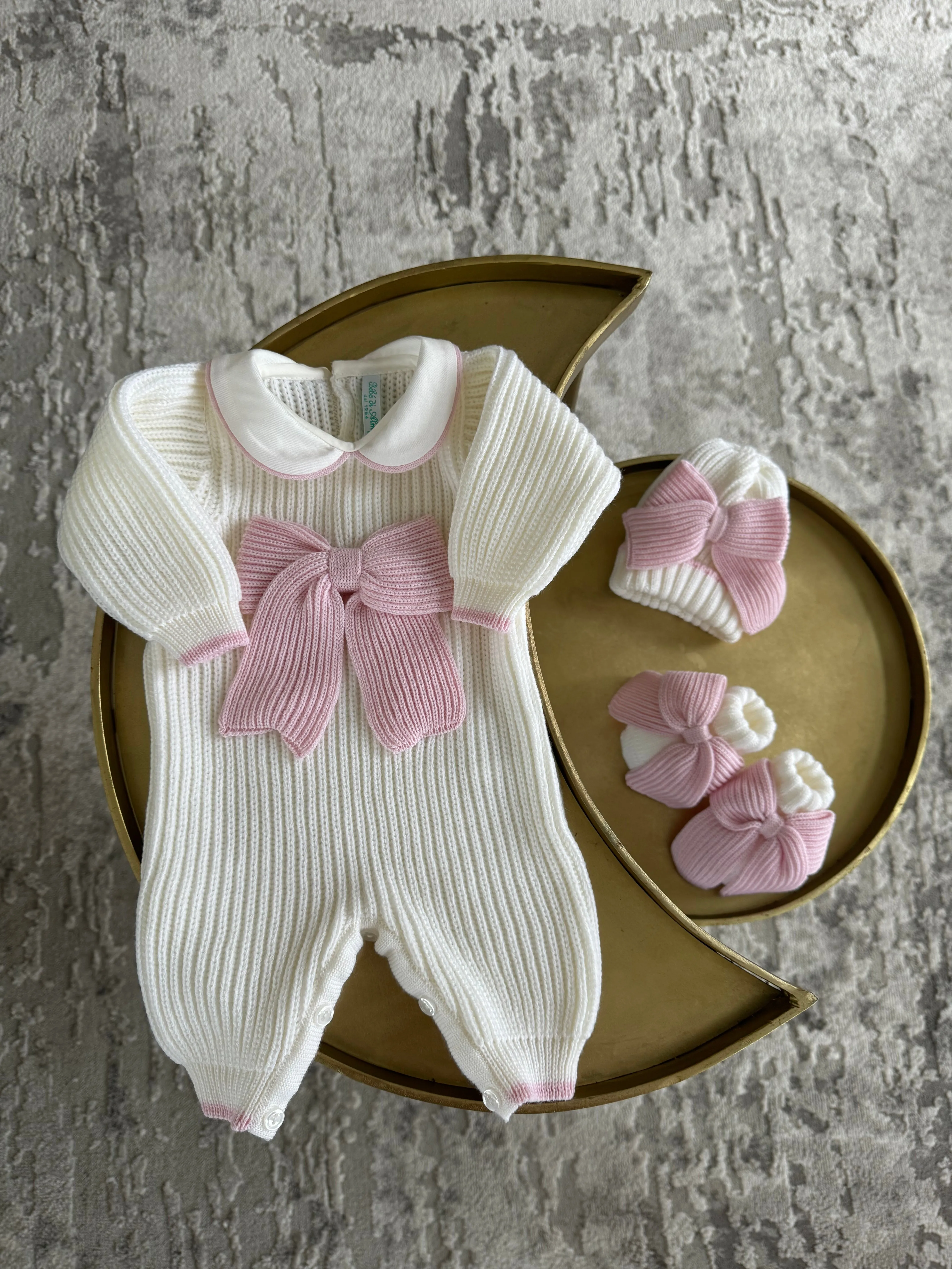 Beautiful knitted Merino Wool Ivory/White Baby Girl Romper with Bow details.
