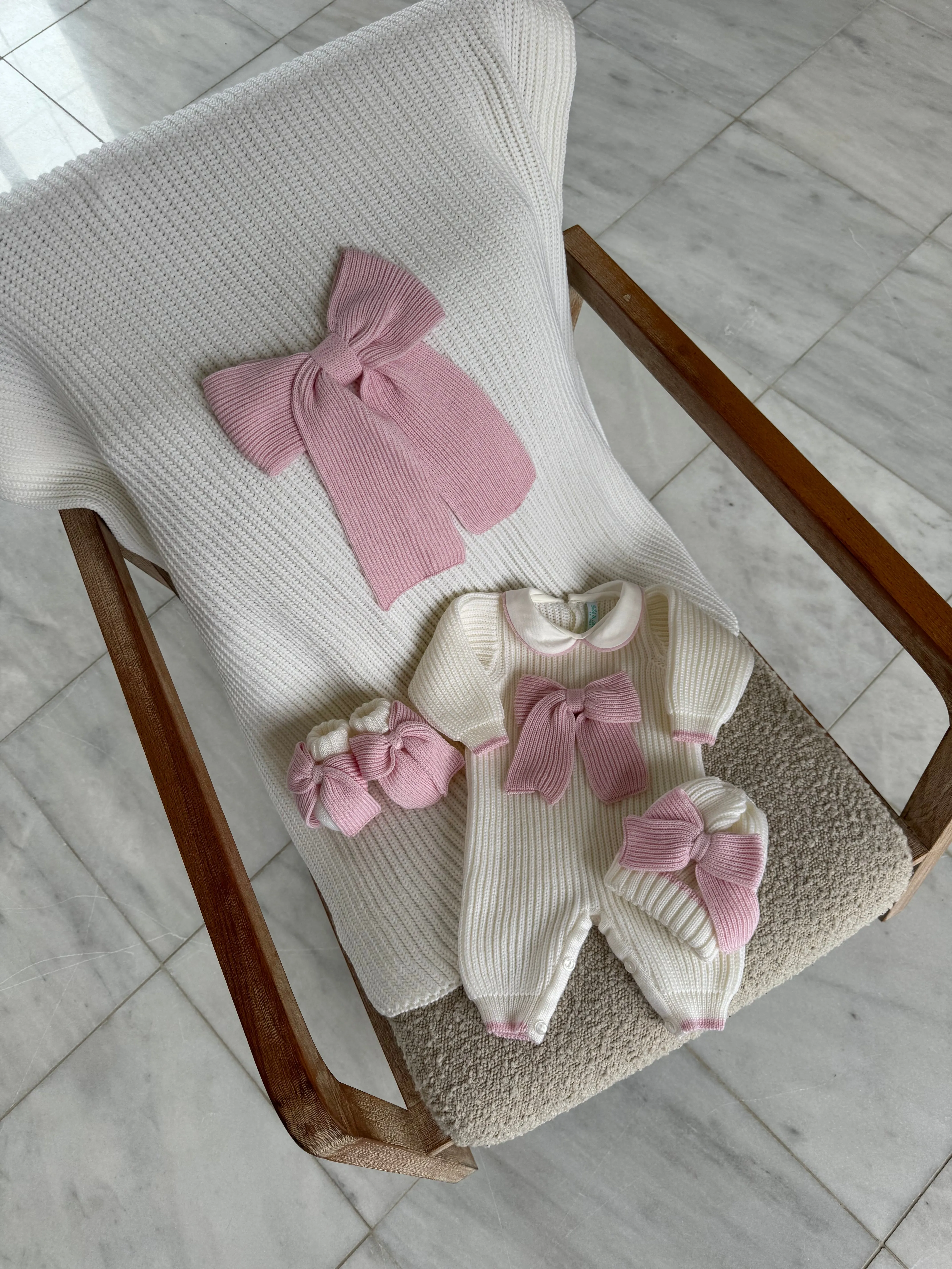 Beautiful knitted Merino Wool Ivory/White Baby Girl Romper with Bow details.